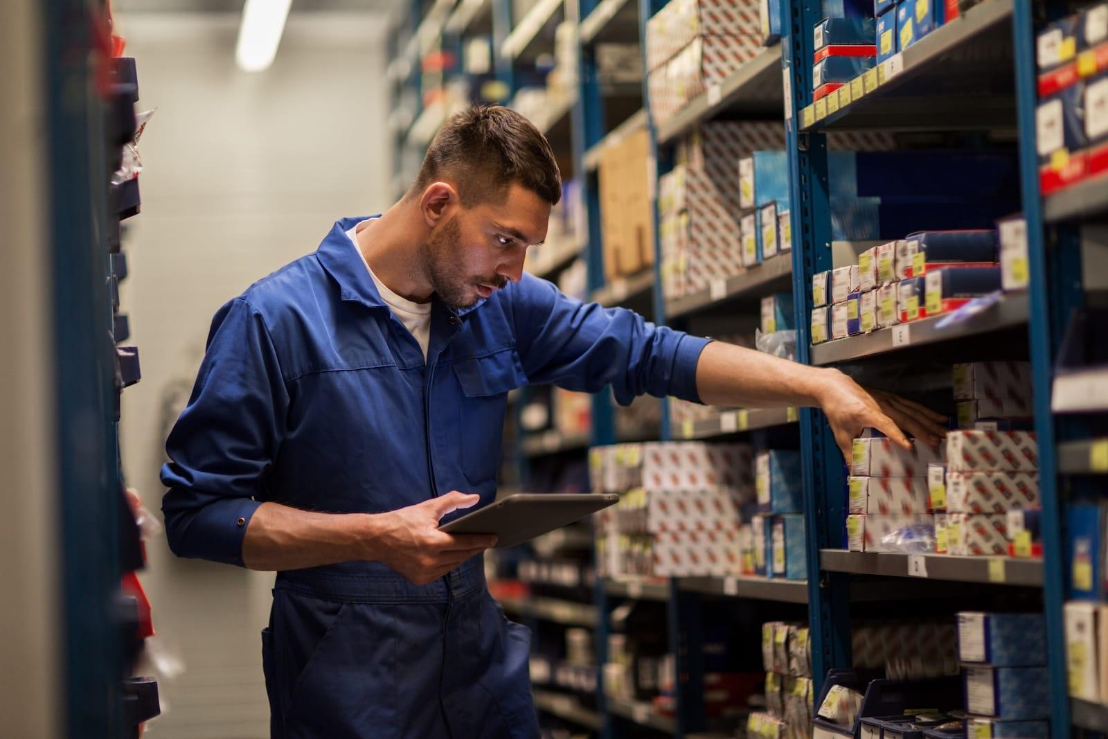 Automotive parts distribution warehouse with components requiring tamper-evident authentication labels