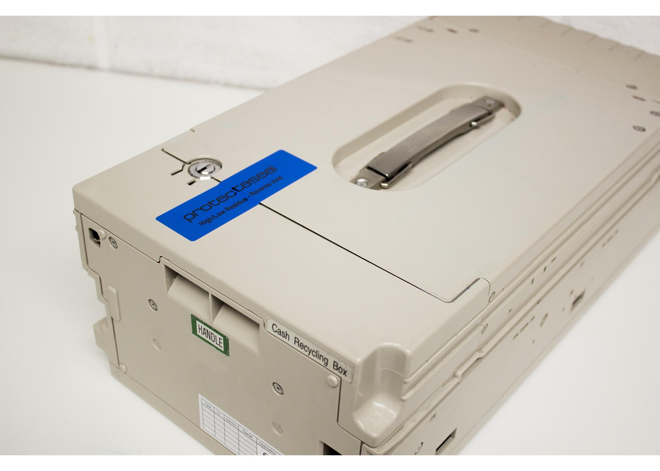 Blue tamper-evident label on a cash recycling security box